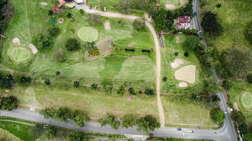 Overhead view of a lush tropical mini-golf course