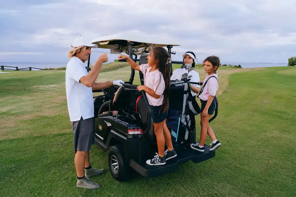 Coworkers laughing together on the golf course
